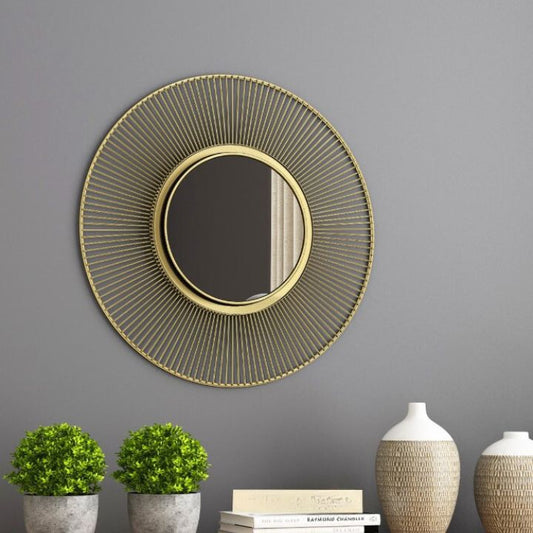 Metallic decorative wall mirror by The Gharnish with a 24-inch diameter, featuring a modern, reflective surface and stylish frame.