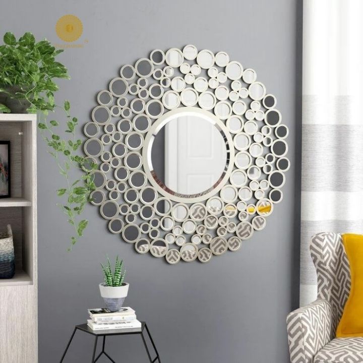 Silver 24-inch multi-panel wall mirror by The Gharnish, featuring a modern design with multiple reflective surfaces.