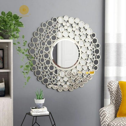 Silver 24-inch multi-panel wall mirror by The Gharnish, featuring a modern design with multiple reflective surfaces.