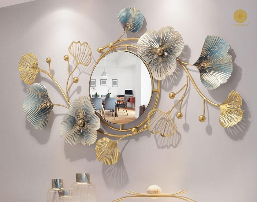 Designer flower and leaf wall mirror by The Gharnish, 40x18 inches, featuring intricate floral and leaf details for decorative wall decor.