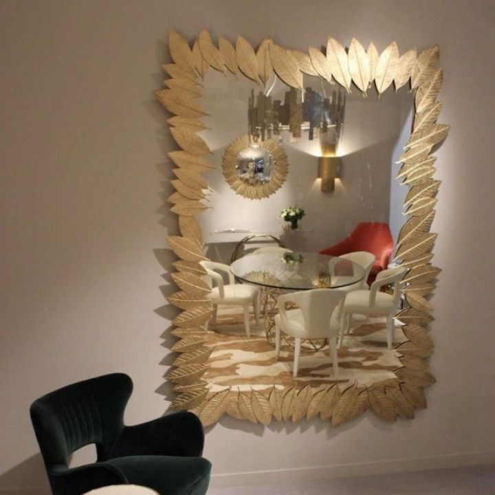 Gold plated leaves wall mirror by The Gharnish, 24x15 inches, featuring a decorative leafy frame for elegant interior decor.