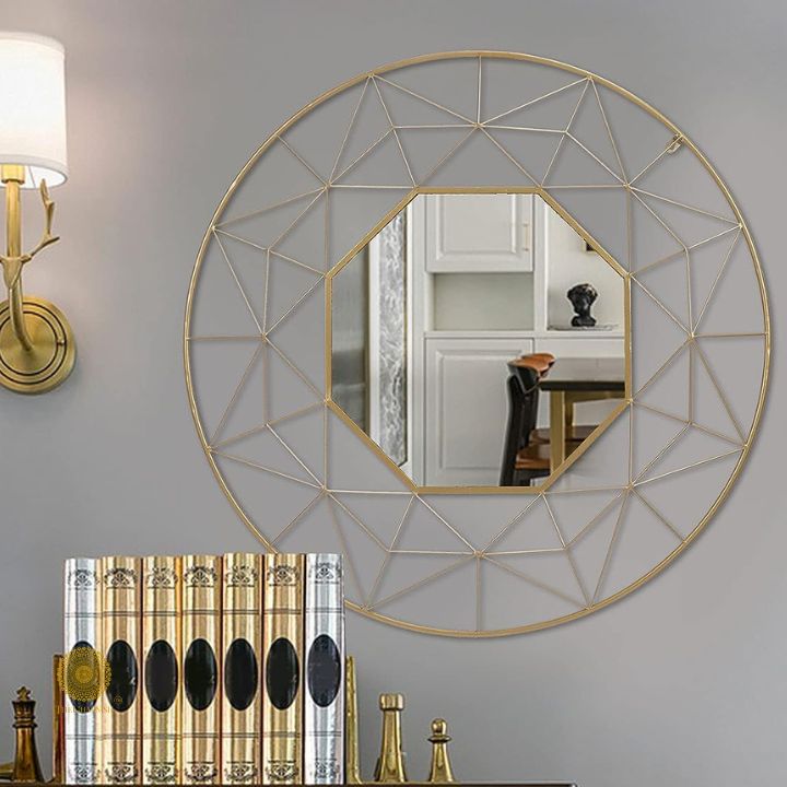 Geometrical designed 30-inch diameter wall mirror by The Gharnish with modern geometric frame and reflective glass surface.