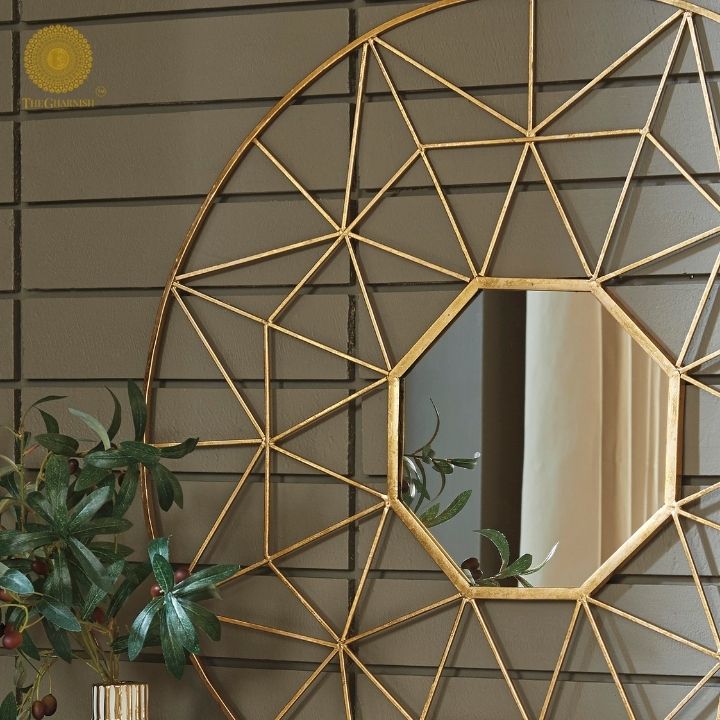 Geometrical designed wall mirror by The Gharnish, 30-inch diameter, with a modern geometric frame reflecting a stylish interior.