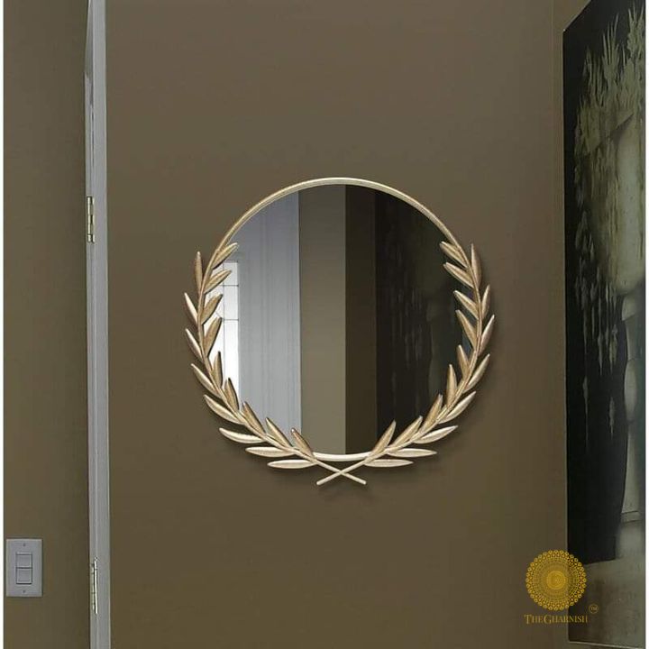 Metallic palm leaf wall mirror by The Gharnish, 24-inch round mirror with a stylish palm leaf frame for wall decor.