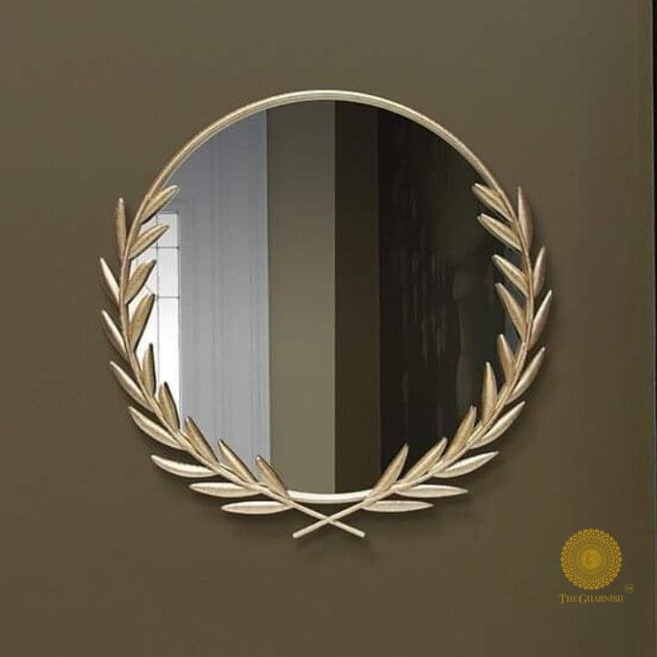 Metallic palm leaf wall mirror by The Gharnish, 24-inch decorative wall mirror with a stylish tropical design.