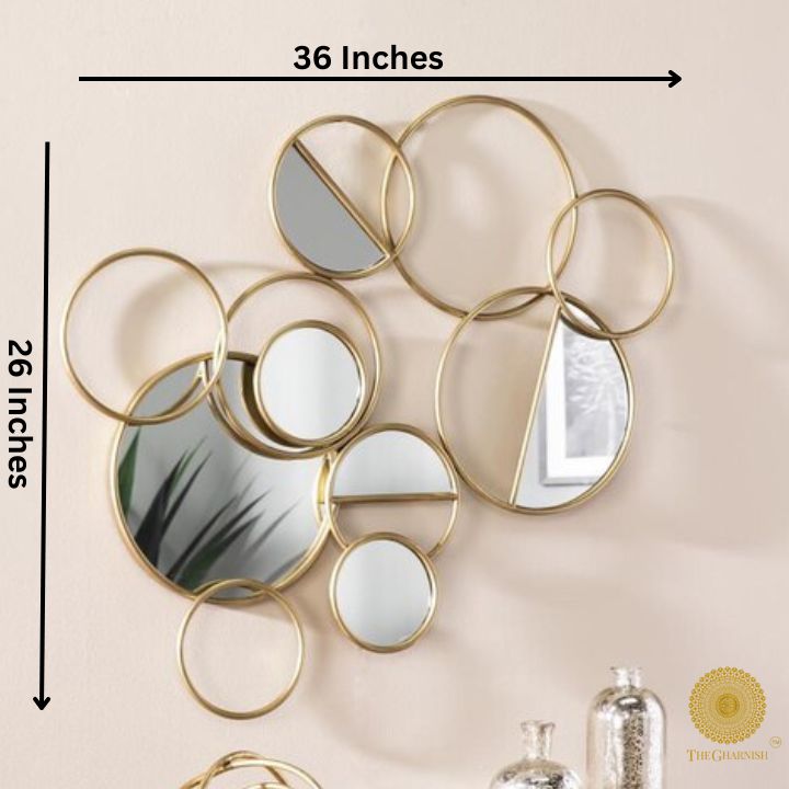 The Gharnish Ring of Rings Wall Mirror, 36x26 inches, featuring interconnected circular mirror design for modern decor.