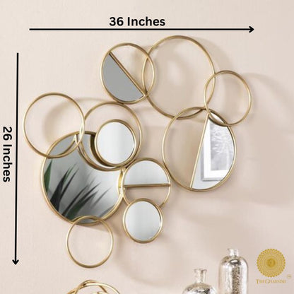 The Gharnish Ring of Rings Wall Mirror, 36x26 inches, featuring interconnected circular mirror design for modern decor.