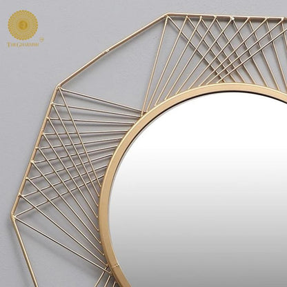 24-inch spider web design wall mirror by The Gharnish, featuring an intricate web pattern around a round glass surface.