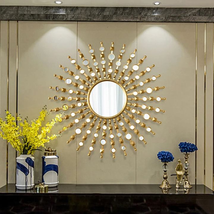 Stylish 30-inch diameter designer wall mirror by The Gharnish with a sleek, modern frame hanging on a wall.