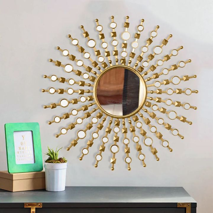 Stylish 30-inch diameter designer wall mirror by The Gharnish with a modern frame, perfect for contemporary home decor.