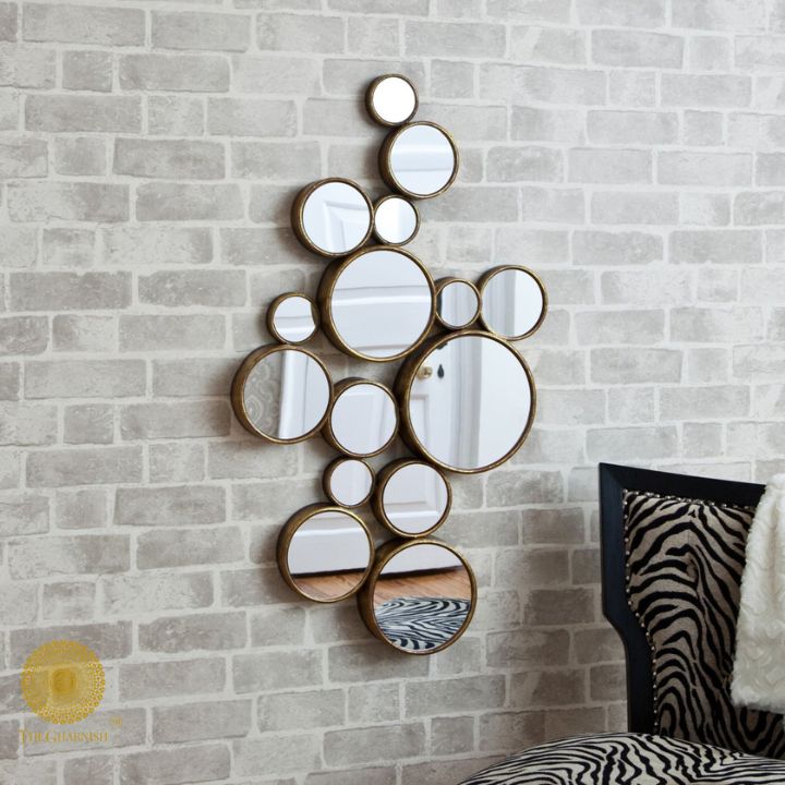 Decorative gold finish wall mirror with 15 circular designs, 48x30 inches, by The Gharnish for stylish interior decor.