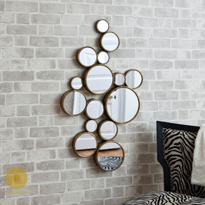 Decorative gold finish wall mirror with 15 circular designs, 48x30 inches, by The Gharnish for stylish interior decor.