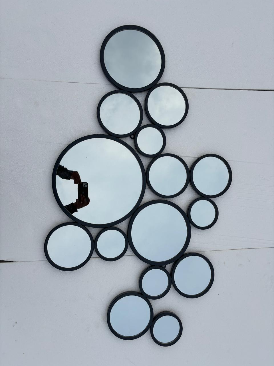 Decorative gold-finish wall mirror with 15 circular elements, 48x30 inches, by The Gharnish for modern home decor.