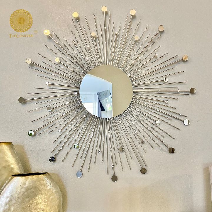 Silver wall mirror with gold sprinkled rays design, 30-inch diameter, by The Gharnish. Reflective and decorative wall art.