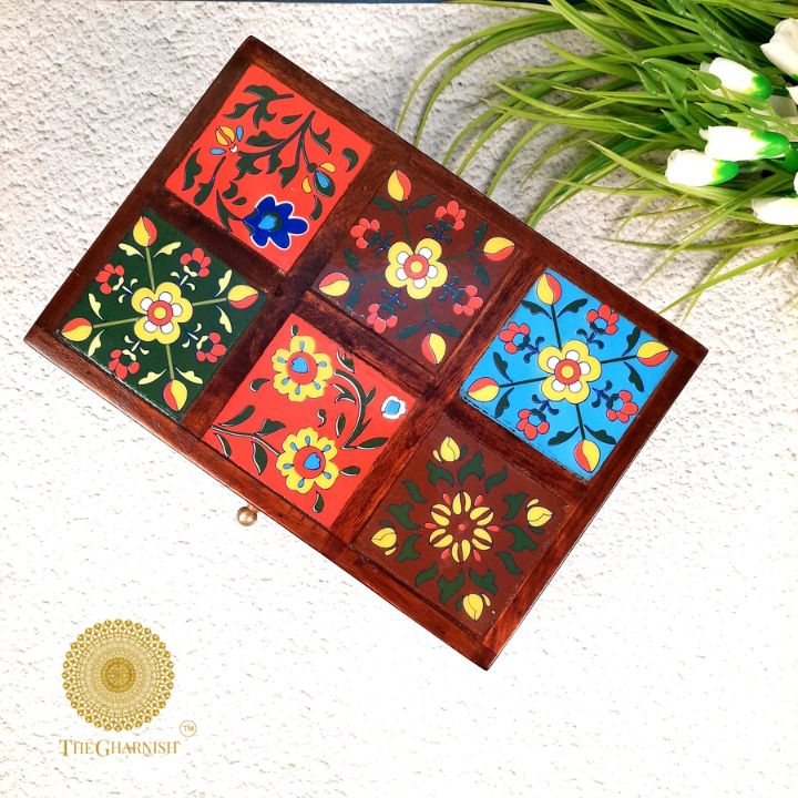 Multicolor wooden jewelry box by The Gharnish, featuring intricate woodwork and multiple compartments for organizing jewelry.