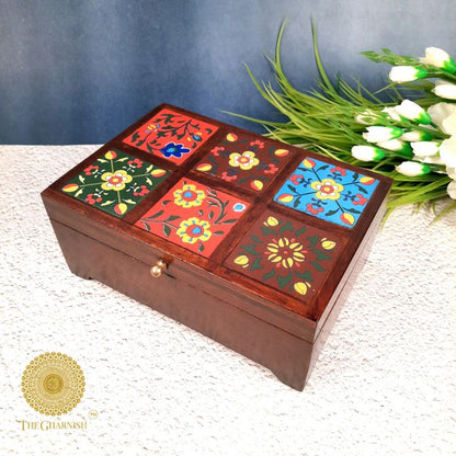 Wooden multicolor jewelry box from The Gharnish, featuring a decorative wooden design with multiple compartments for jewelry storage.
