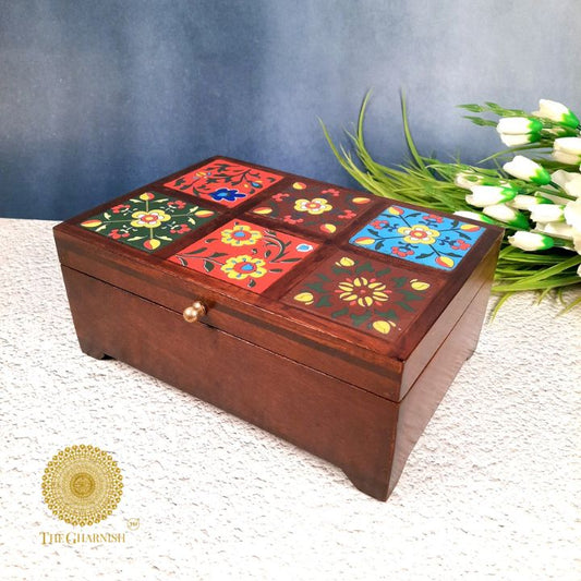Colorful wooden jewelry box from The Gharnish, featuring multiple compartments and decorative wooden craftsmanship.