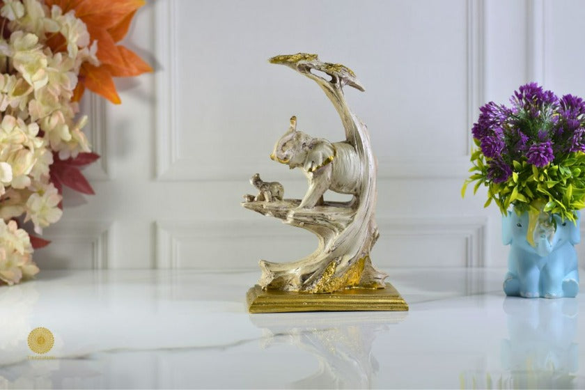 Elephant with baby animal figurine by TheGharnish, detailed sculpture showcasing a mother elephant and her calf in a realistic design.