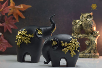 Premium pair of elephant animal figurines by TheGharnish, detailed ceramic sculpture set for home decor or collection.
