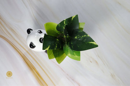 Miniature panda artwork pot by TheGharnish featuring a detailed panda design on a small decorative pottery piece.