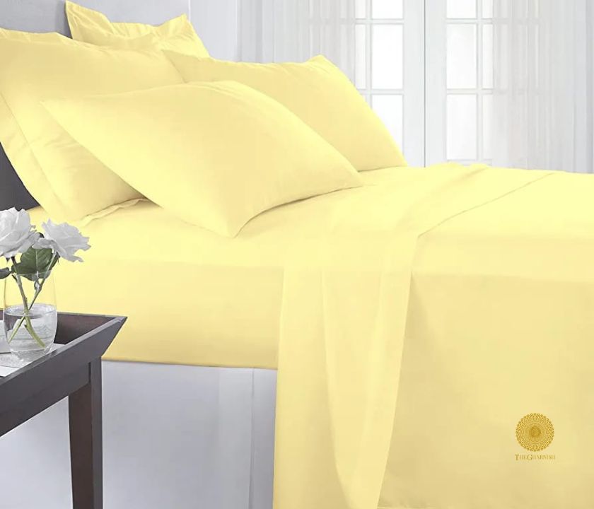 Lemon-colored 100% cotton premium bedsheet by TheGharnish with 300 thread count, showcasing smooth fabric and neat edges.