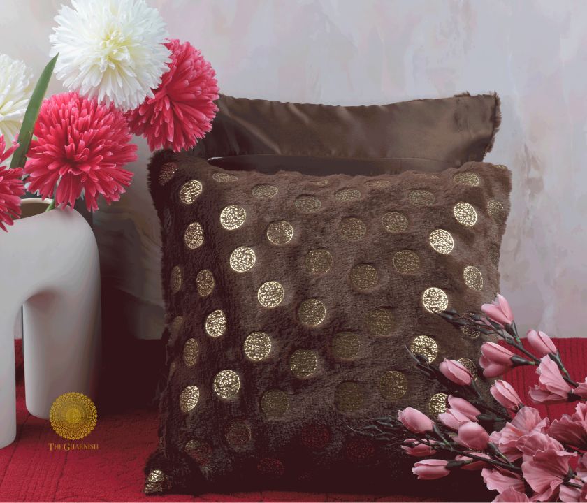 Set of two designer gold printed cushion covers by TheGharnish, featuring elegant decorative patterns on soft fabric.