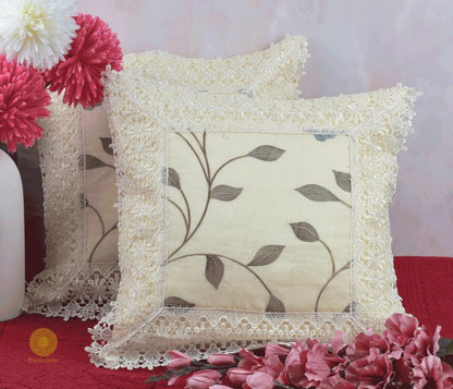 Set of two silk lace cushion covers from TheGharnish, featuring elegant lace detailing on soft fabric for decorative cushions.