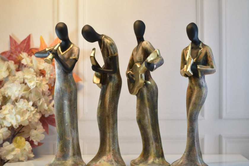 Golden women music band figurine by TheGharnish, detailed sculpture of women performing music, decorative collectible display piece