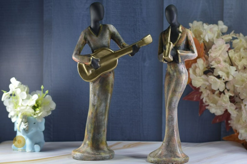 Golden Women Music Band Figurine by TheGharnish, detailed sculpture of women playing musical instruments, decorative art piece