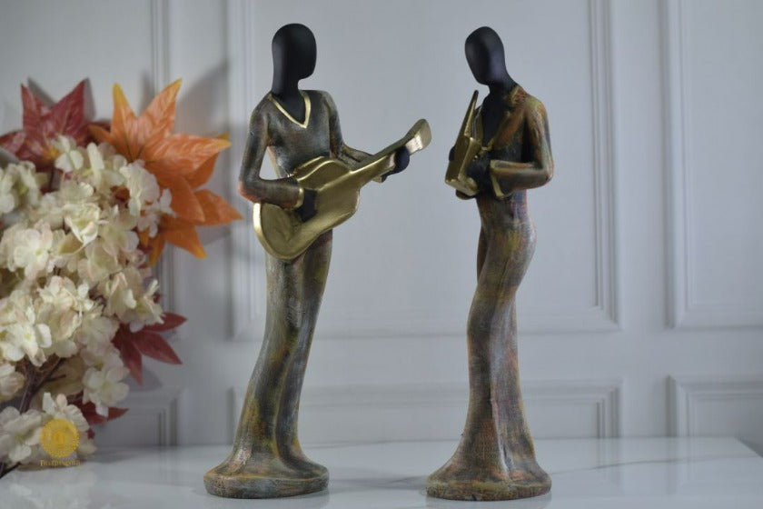 Golden women music band figurine by TheGharnish, detailed sculpture of women musicians with musical instruments.
