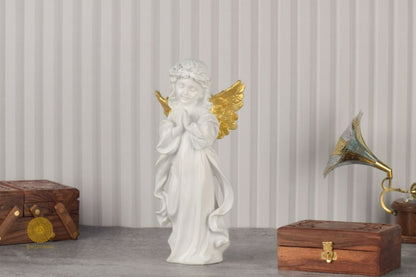 Praying angel figurine by TheGharnish, 6x12 inches, detailed sculpture showcasing a serene angel with hands clasped in prayer.