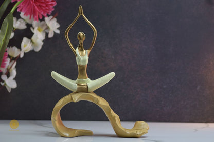 TheGharnish yoga figurine of a lady practicing yoga on a banana leaf, detailed ceramic sculpture with a serene pose.