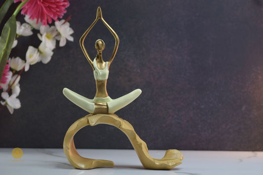TheGharnish yoga figurine of a lady practicing yoga on a banana leaf, detailed ceramic sculpture with a serene pose.