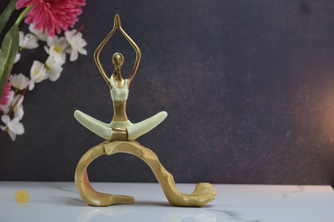 TheGharnish yoga figurine of a lady practicing yoga on a banana leaf, showcasing a serene pose and detailed craftsmanship.