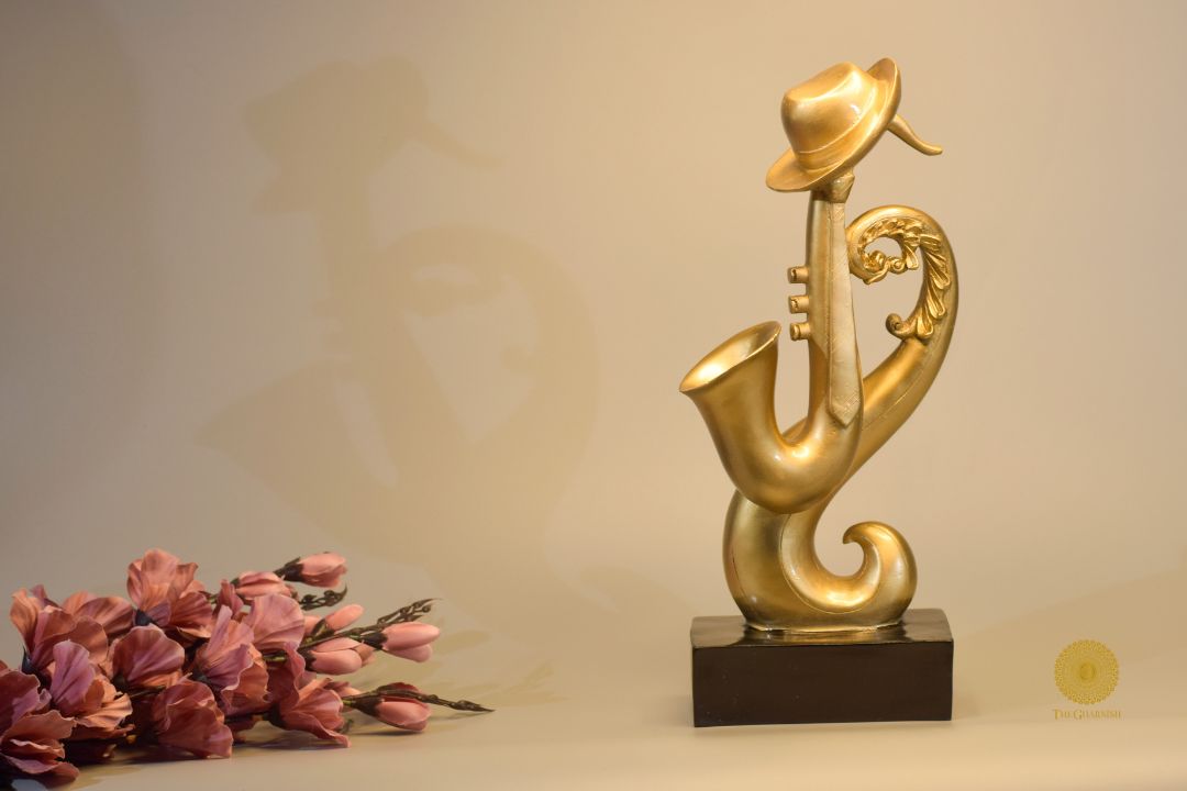 TheGharnish trumpet instrument showpiece figurine showcasing a detailed miniature trumpet sculpture on a decorative base.
