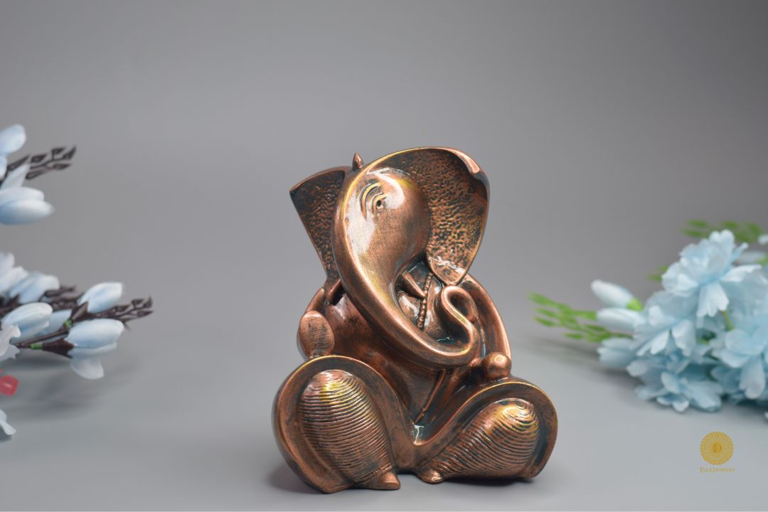 Resting Ganesha Gods figurine showpiece by TheGharnish, depicting Lord Ganesha in a peaceful, seated pose on a decorative base.