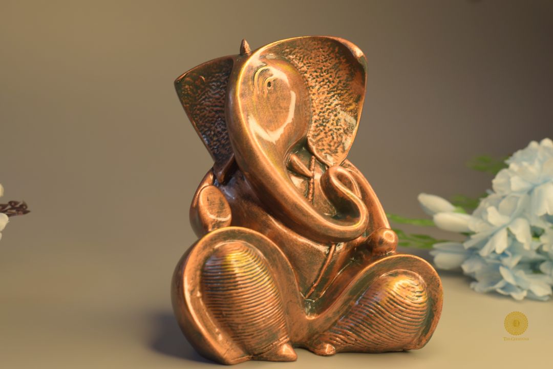 Resting Ganesha figurine showpiece by TheGharnish, detailed Hindu god sculpture for home decor or spiritual space.