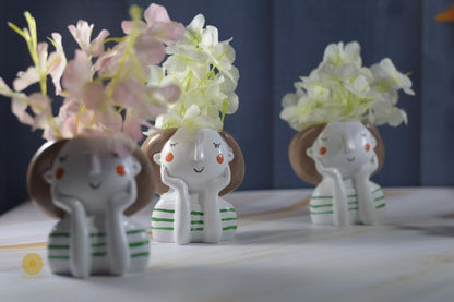 Miniature cute girl face planter by TheGharnish featuring a charming face design and small plant compartment.