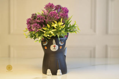 Miniature black cat planter from TheGharnish featuring a small, detailed black cat figure with a hollow interior for plants.