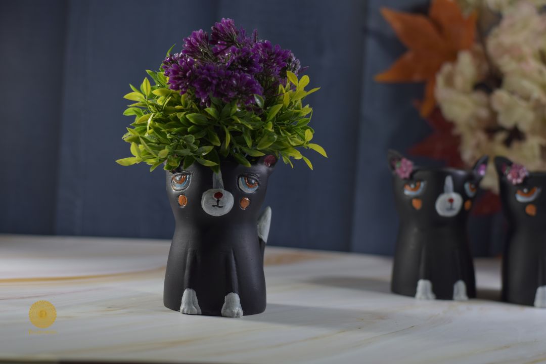 Miniature black cat planter by TheGharnish, featuring a cute black cat shape with a hollow interior for small plants.