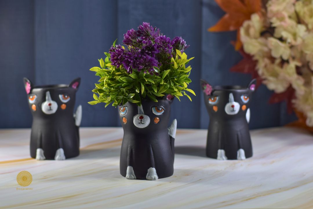 Miniature black cat planter by TheGharnish featuring a small, detailed black cat figure with a hollow interior for plants.