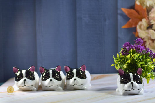 Miniature dog-shaped table planter from TheGharnish, with a small plant inside, showcasing detailed design and ceramic finish.