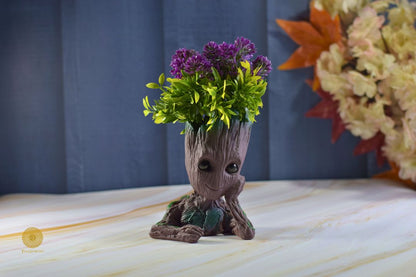 Thoughtful Groot miniature figurine by TheGharnish, showing Groot with a contemplative expression and detailed tree bark texture.