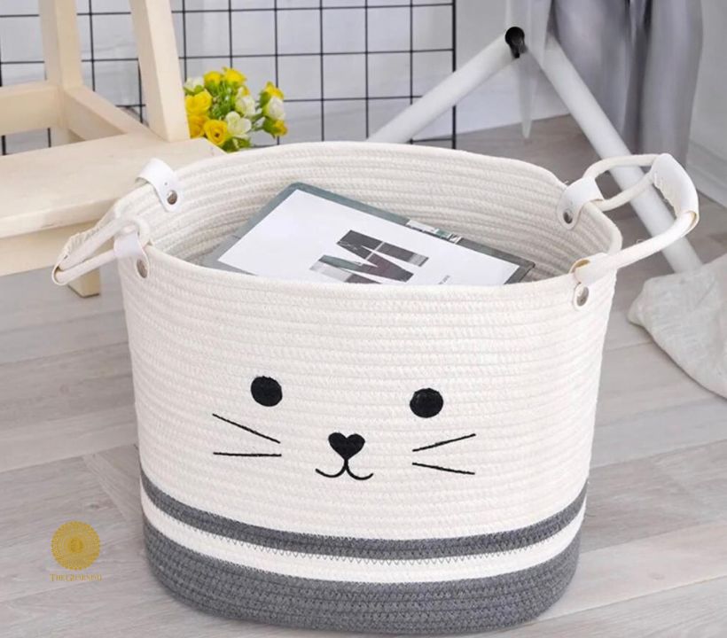 Yellow fabric storage basket with embroidered cat design, ideal for laundry or organization, by TheGharnish.