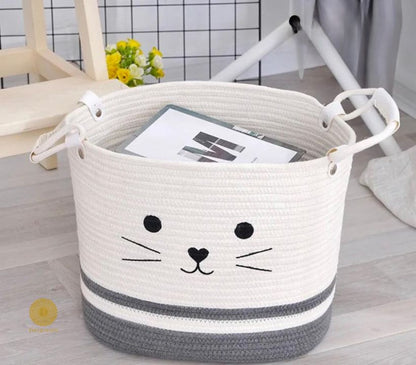 Yellow fabric storage basket with embroidered cat design, ideal for laundry or organization, by TheGharnish.