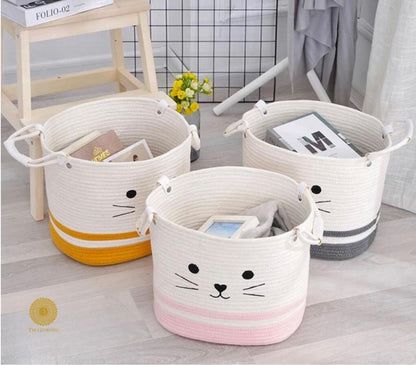 Yellow fabric storage basket with embroidered cat design, ideal for laundry or organization by TheGharnish.