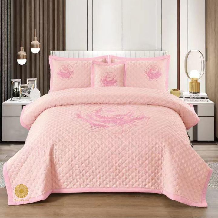 TheGharnish Paradise solid colour quilted bedcover with heavy embroidery, showcasing intricate stitching and plush fabric.