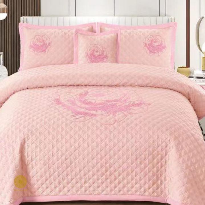 TheGharnish Paradise solid color quilted bedcover with heavy embroidery, showcasing intricate stitching and plush texture.