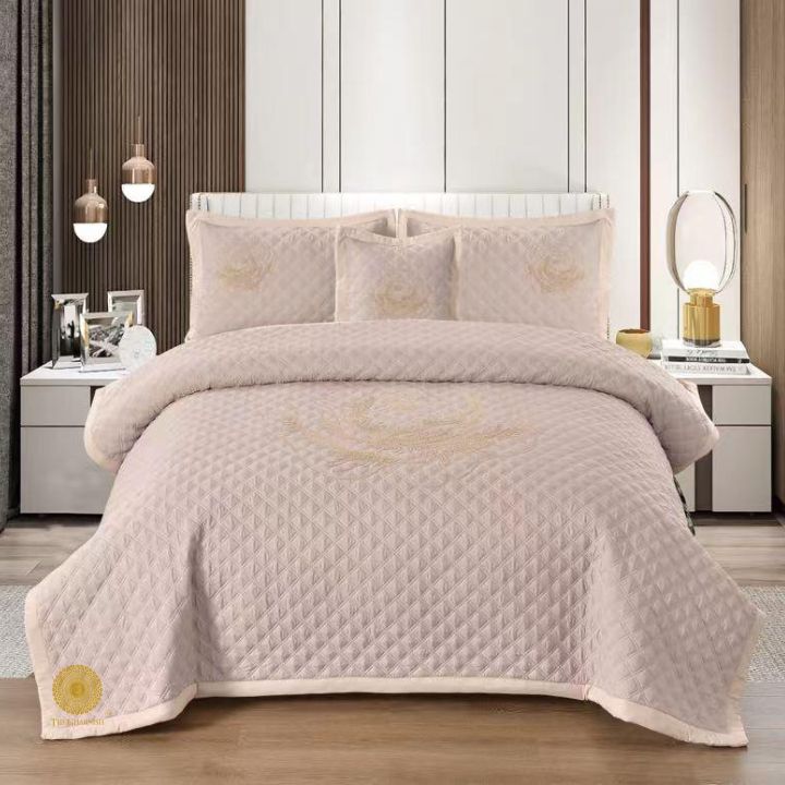 TheGharnish Paradise solid color quilted bedcover with heavy embroidery, showcasing intricate stitching and luxurious fabric.