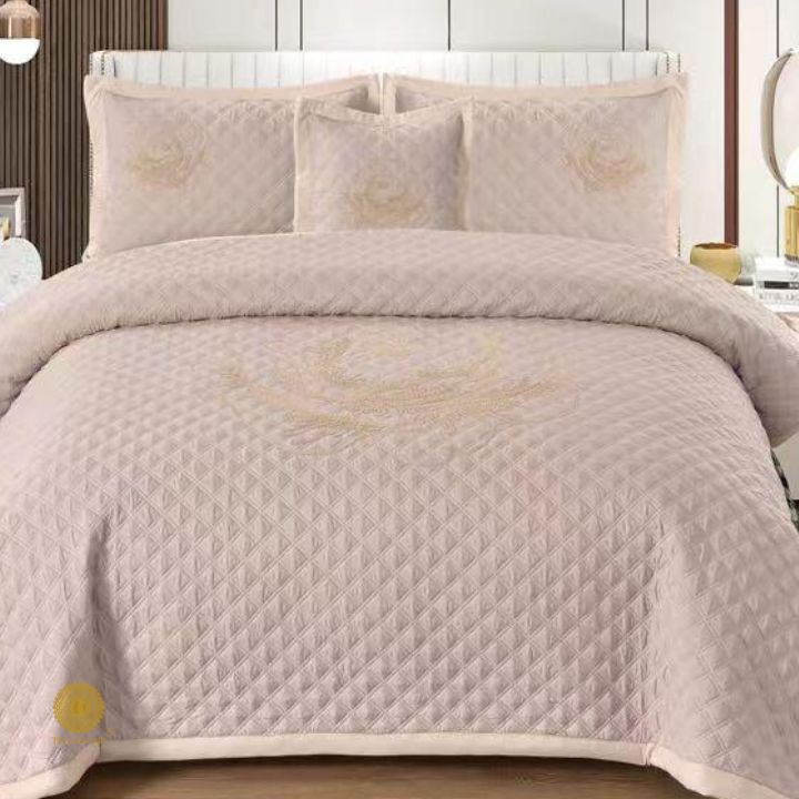 TheGharnish Paradise solid color quilted bedcover with heavy embroidery, showcasing intricate stitched patterns on soft fabric.